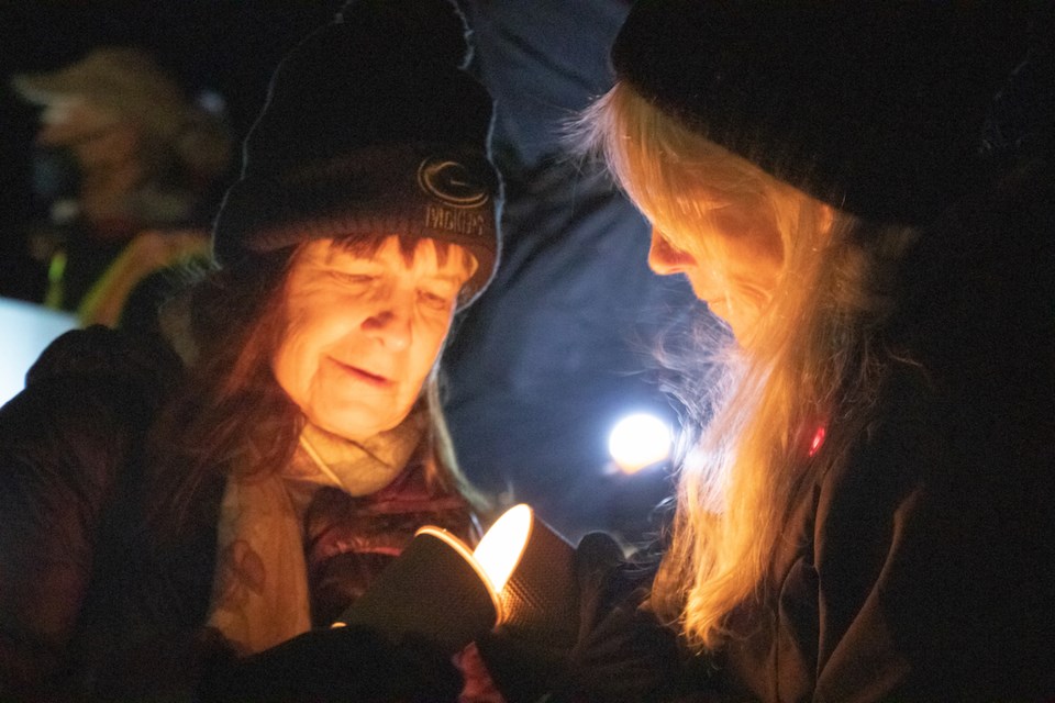 A dozen or so people attended a candlelight vigil for victims of climate change outside of MLA Nicolas Simons’s office and on the Davis Bay pier Dec. 13.